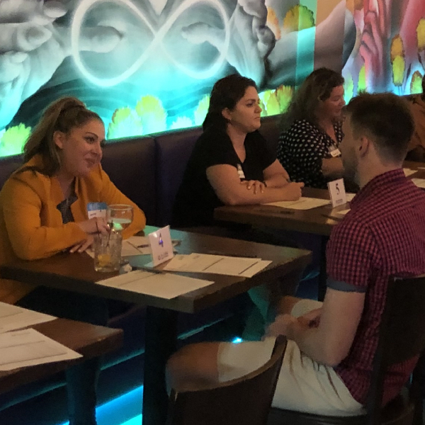 Attendees at a AL speed dating event